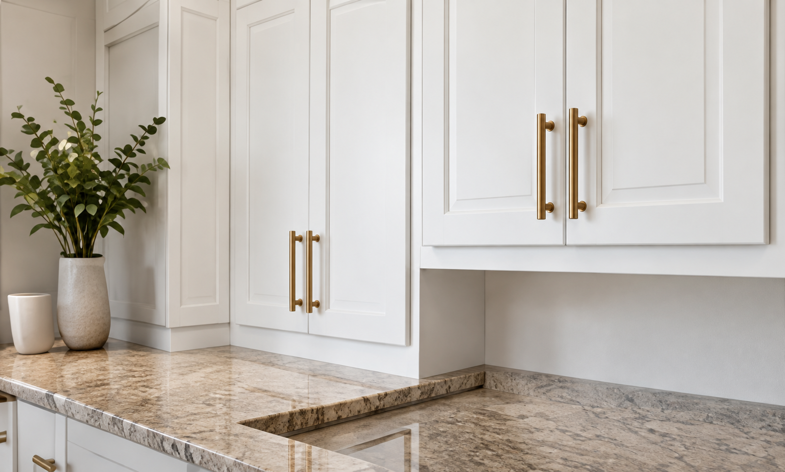 Fresh white kitchen cabinets with brass handles